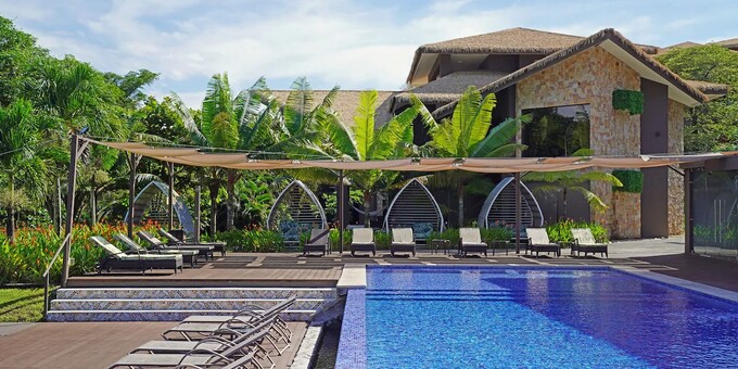 Discover the serene oasis of Nammbu Bungalows in Costa Rica's Guanacaste region. Nestled amidst lush tropical landscapes, our thoughtfully designed bungalows provide a cozy and immersive retreat. Indulge in delectable cuisine, unwind by the inviting pool, and explore the wonders of Guanacaste through nature adventures and water sports. With dedicated staff ensuring a memorable stay, Nammbu Bungalows offers the perfect blend of relaxation and adventure for an unforgettable Costa Rican experience. The hotel is located across the street from the gorgeous Carrillo Beach on a small hillside. Hotel amenities include a swimming pool, restaurant, bar, spa, concierge service, tropical gardens, and WiFi internet.