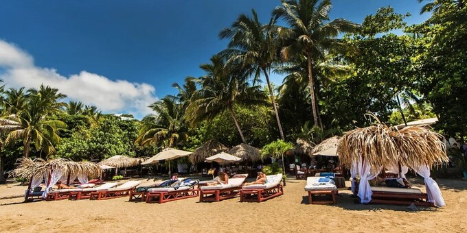 Welcome to Locanda Samara Beach Hotel, a hidden gem nestled along the pristine shores of Samara Beach in Costa Rica. Our intimate budget-friendly beachfront hotel boasts 17 well-appointed rooms that provide the perfect blend of comfort and rustic charm, ensuring a tranquil stay just steps from the Pacific Ocean. Start your day with a delectable breakfast at our inviting restaurant, where you can savor local flavors while enjoying picturesque ocean views. Immerse yourself in the pura vida lifestyle as you relax by our refreshing pool, enveloped by lush tropical gardens. For those seeking adventure, Samara Beach offers a wide range of thrilling activities, from surfing and horseback riding to exploring the vibrant marine life while kayaking and snorkeling. Nature enthusiasts will be captivated by the nearby wildlife reserves, where you can observe diverse species of birds and animals in their natural habitat. Our dedicated staff is always at your service, ensuring your stay is filled with unforgettable moments and relaxation. Whether you're a couple in search of a romantic getaway, a family seeking quality time together, or a group of friends embarking on an adventure, Locanda Samara Beach Hotel welcomes you to experience the pure essence of Costa Rica's tropical paradise.