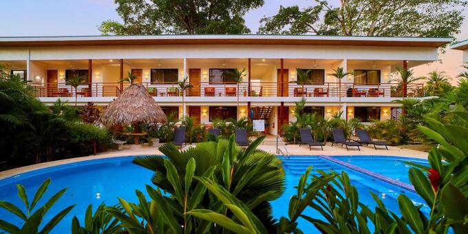 <p>Olinca Boutique Hotel, in the vibrant heart of Puerto Viejo, Costa Rica, offers a tranquil escape, blending rustic charm with modern comforts. This intimate hotel features lush, tropical gardens, a secluded oasis near the town center and Caribbean beaches. Its design embraces natural beauty and a warm palette. Accommodations provide a relaxing experience, with tropical designs, vibrant textiles, and garden-view balconies or terraces, plus amenities like air conditioning, Wi-Fi, and well-appointed bathrooms. Olinca fosters community and personalized service, with attentive staff and communal areas like the pool and lounge. Its location is ideal, minutes from Salsa Brava, Playa Puerto Viejo, and Playa Cocles, with Puerto Viejo's eclectic offerings within walking distance, allowing seamless transitions between tranquility and lively energy. Ultimately, Olinca delivers a unique, authentic Puerto Viejo experience, where guests unwind amidst Caribbean beauty, enjoy personalized service, and immerse in vibrant culture, ensuring a memorable, rejuvenating stay, a testament to the laid-back elegance of this beloved destination.</p>
