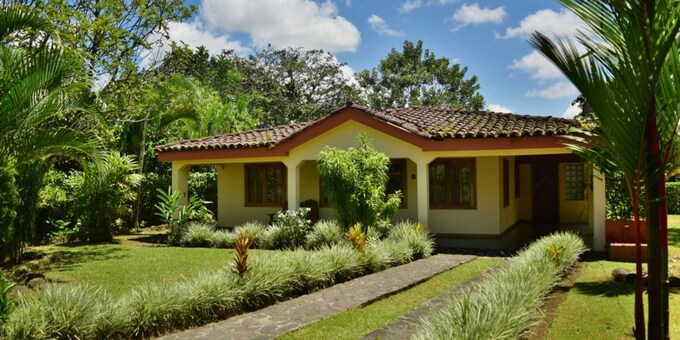 <p>Escape to the heart of El Castillo with Mirador House, a cozy two-bedroom vacation rental offering comfort and convenience for your Costa Rican getaway.  Just steps from the village center, this charming home features a fully equipped kitchen, a living room with a futon for extra sleeping space, and two air-conditioned bedrooms, each with a queen-size bed.  Enjoy the beautiful gardens, the gazebo with stunning volcano views, and the convenience of a laundry area.  Explore nearby attractions like Arenal Volcano, hanging bridges, and waterfalls, or simply relax and soak in the vibrant atmosphere of El Castillo.  Mirador House provides the perfect blend of tranquility and accessibility, making it an ideal choice for families or small groups seeking a memorable vacation.</p>