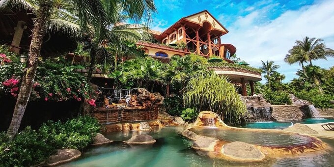 <p>The Springs Resort in La Fortuna, Costa Rica, is a luxurious and breathtaking oasis nestled amidst the lush rainforest with sweeping views of the majestic Arenal Volcano. This five-star resort offers a truly immersive and unforgettable experience for guests seeking relaxation and adventure. The resort's spacious and elegantly appointed rooms and villas provide a serene and comfortable sanctuary, many of which feature private balconies or terraces overlooking the volcano or the pristine rainforest. The highlight of the resort is its impressive collection of thermal hot springs, where guests can soak in the healing mineral-rich waters while surrounded by lush greenery. The resort also offers a variety of exhilarating activities, including whitewater tubing, hiking, and horseback riding, allowing guests to explore the stunning natural surroundings. Indulge in culinary delights at the resort's multiple restaurants, offering a fusion of international and local cuisine. With exceptional service, world-class amenities, and an unrivaled setting, The Springs Resort offers an unforgettable retreat in the breathtaking beauty of La Fortuna, Costa Rica. Resort amenities include thermal hot springs, internet access, a restaurant, bar, tropical gardens, a spa, and Club del Rio (additional discounted charge).</p>
