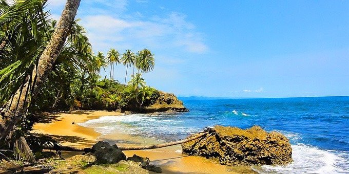Sitting on the southern Caribbean coast of Costa Rica, you’ll find the quiet sandy shores of Punta Uva. Home to a small number of residents and mildly populated by tourism, this peaceful place is only a five-minute walk to the Gandoca Manzanillo National Wildlife Refuge.