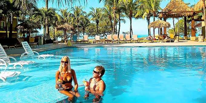 Imagine yourself sipping a tropical cocktail on a pristine beach, the warm sun kissing your skin as gentle waves lap the shore.